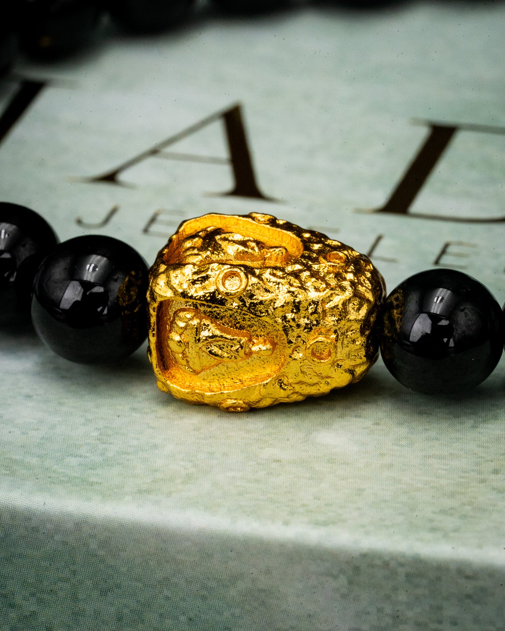 Gold Meditating Buddha Charm Black Beaded Jade Bracelet